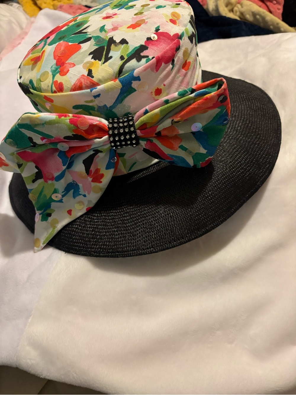Black Wide-Brim Hat with Multicolor Floral Band and bow shoulder strap purse.